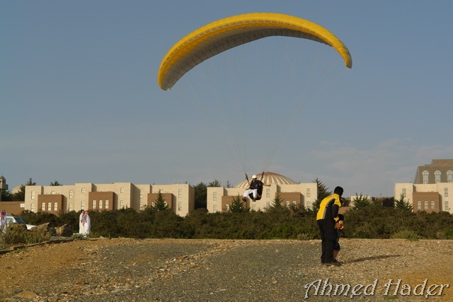 adventure parachuting over mountain near clouds